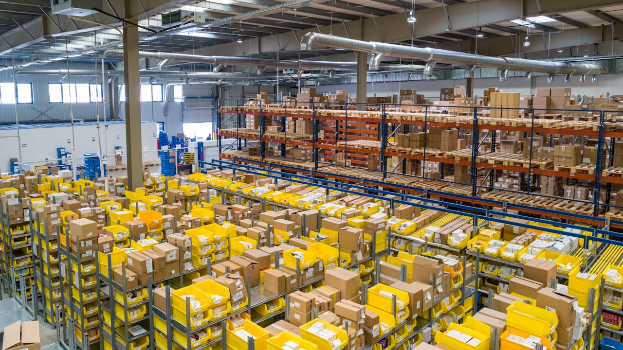 Worker scanning packages in a multi-channel warehouse